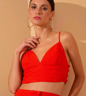
                  
                    model wears v-neck coral cropped top.
                  
                