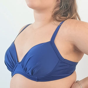 
                  
                    model wears blue booster bikini top.
                  
                