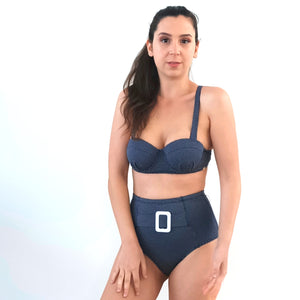 
                  
                    model wears blue high waisted bikini bottom and booster bikini top.
                  
                