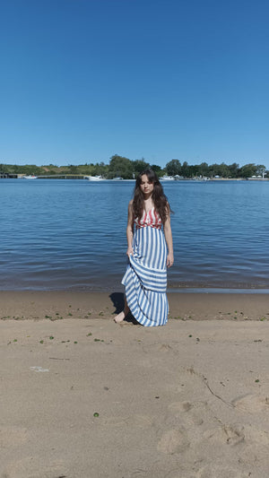 
                  
                    Load and play video in Gallery viewer, video of model walking on the beach wearing a blue and red striped dress.
                  
                